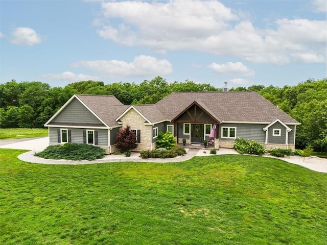 craftsman-style house with a front yard