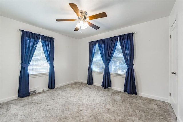 carpeted empty room with ceiling fan