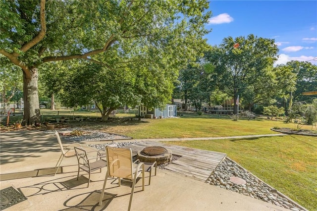 view of patio / terrace with an outdoor fire pit