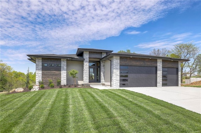 prairie-style home with a garage and a front lawn