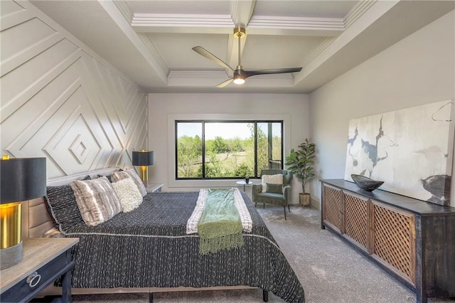 bedroom with ceiling fan, beamed ceiling, carpet, a tray ceiling, and crown molding