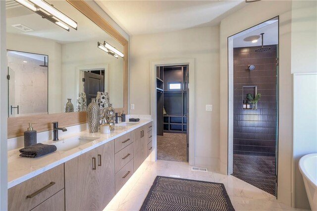 bathroom with independent shower and bath and vanity