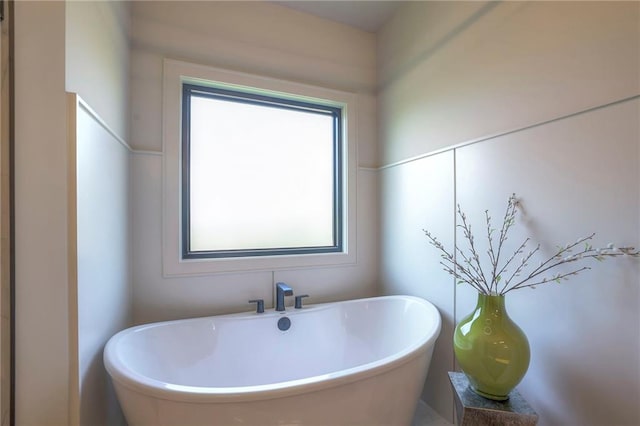 bathroom featuring a tub to relax in