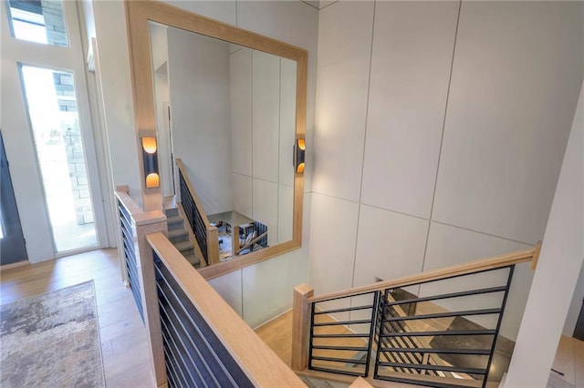 staircase featuring wood-type flooring