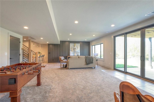 rec room with light tile patterned flooring