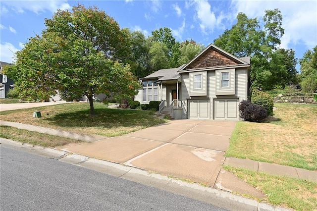 view of front of property featuring a garage and a front yard