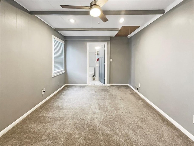 spare room featuring ceiling fan, beamed ceiling, and carpet floors