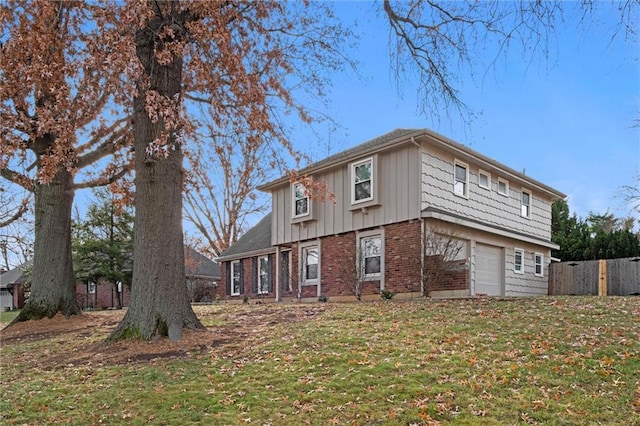 view of front of house with a front lawn and a garage