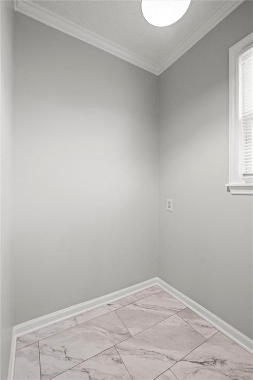 empty room featuring ornamental molding