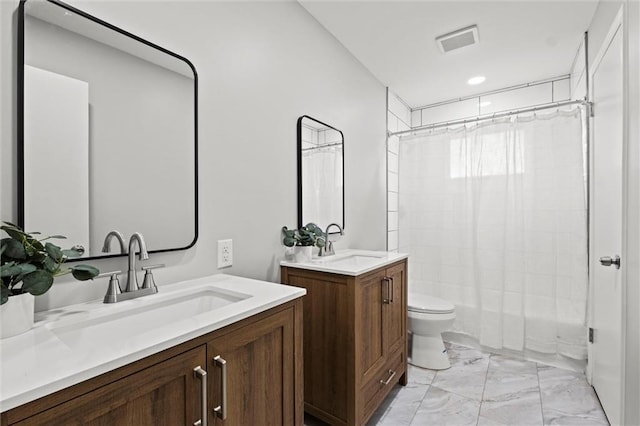 full bathroom with vanity, toilet, and shower / bath combo with shower curtain