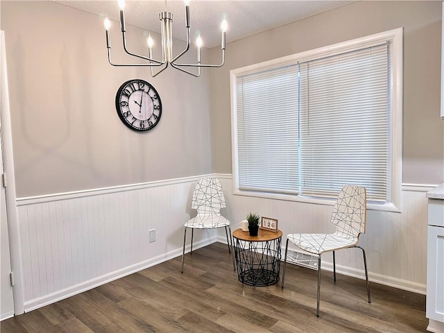 sitting room with hardwood / wood-style flooring and a textured ceiling