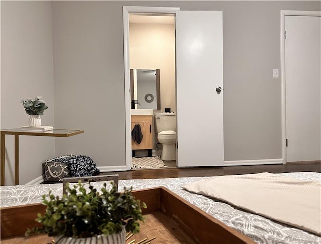 bedroom featuring connected bathroom