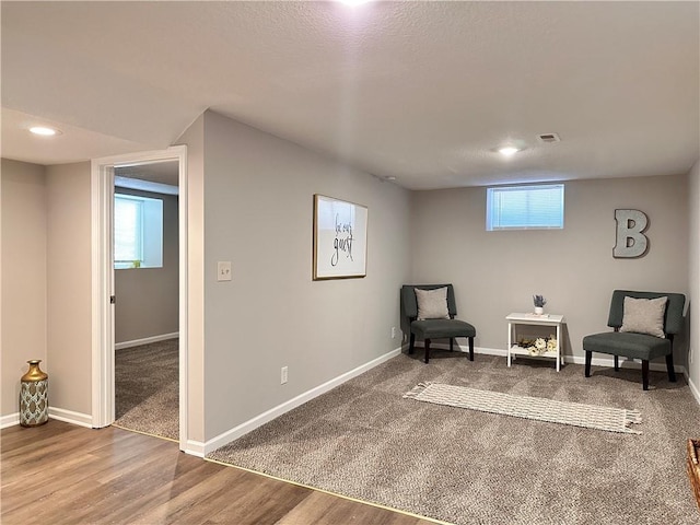 sitting room featuring hardwood / wood-style flooring and plenty of natural light