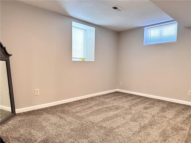 basement featuring carpet flooring