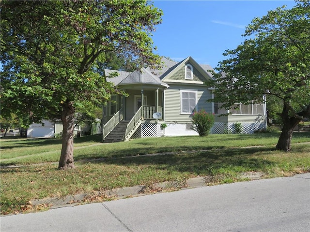 view of front of property with a porch and a front lawn