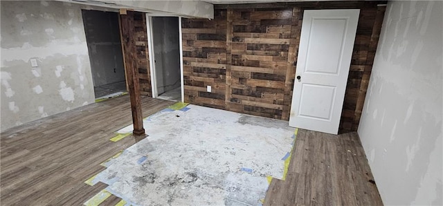 basement featuring hardwood / wood-style floors