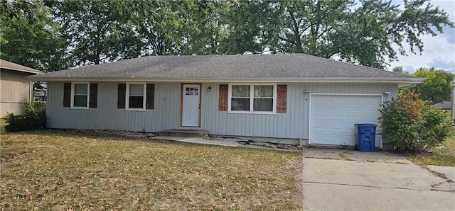 ranch-style house with a front lawn and a garage