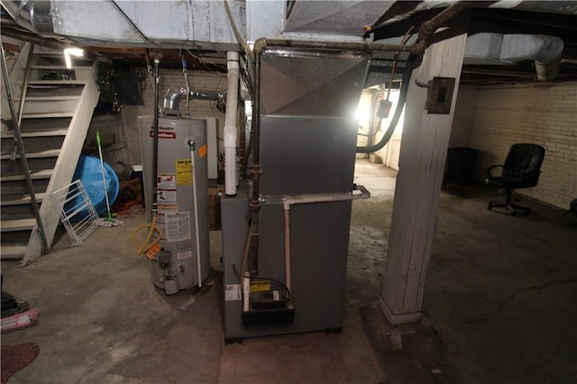 utility room featuring water heater and heating unit