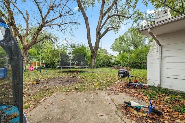 view of yard featuring a trampoline