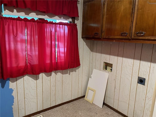 washroom with cabinets, hookup for an electric dryer, and hookup for a washing machine