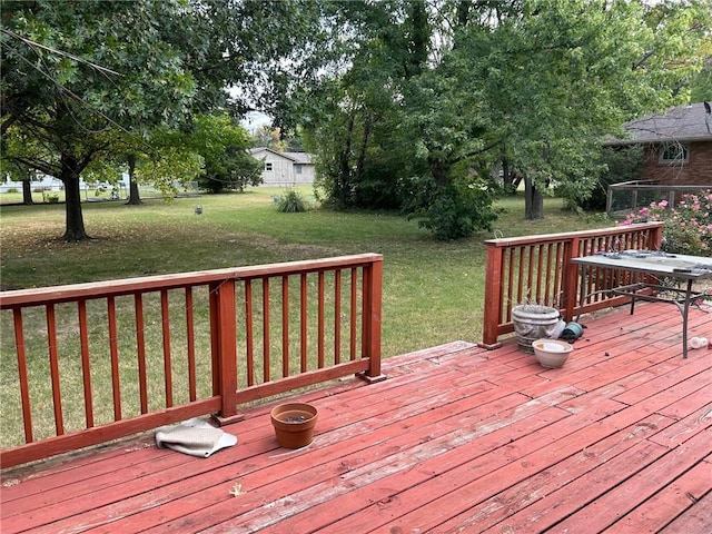 wooden deck with a yard