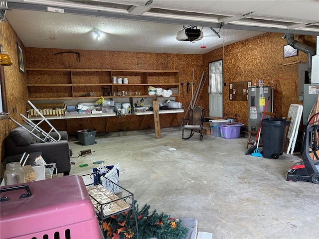 garage featuring water heater and a garage door opener