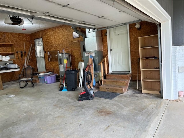 garage with water heater and a garage door opener