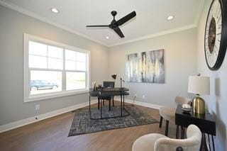 office area with ornamental molding, dark wood-type flooring, and ceiling fan