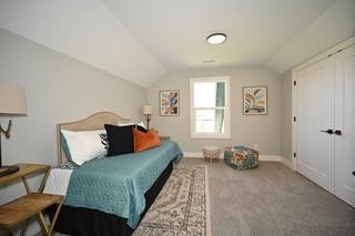 bedroom with lofted ceiling and carpet floors