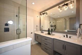 bathroom featuring vanity, an enclosed shower, and tile patterned floors