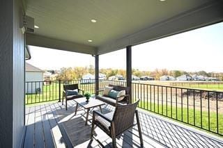 wooden deck with an outdoor living space