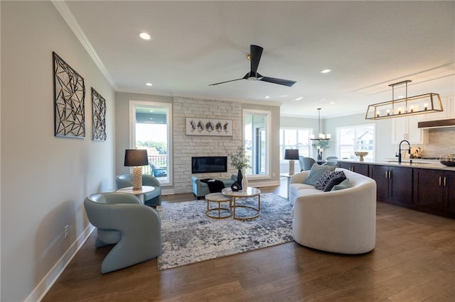 12850 N Arbor Way, Platte City, MO 64079 - living area with ornamental molding, dark wood finished floors, plenty of natural light, and recessed lighting