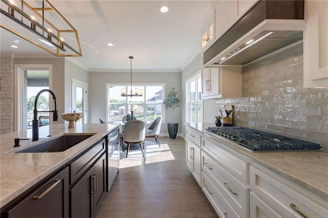 12850 N Arbor Way, Platte City, MO 64079 - kitchen with wall chimney range hood, stainless steel appliances, dark wood-style floors, decorative backsplash, and white cabinetry