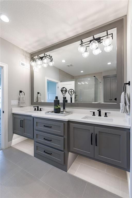 12850 N Arbor Way, Platte City, MO 64079 - full bathroom featuring tile patterned flooring, double vanity, and a tile shower