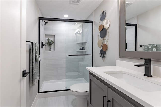 12850 N Arbor Way, Platte City, MO 64079 - bathroom with vanity, a shower stall, a textured ceiling, and marble look tiles