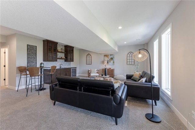 12850 N Arbor Way, Platte City, MO 64079 - living room with light colored carpet, plenty of natural light, and beverage cooler