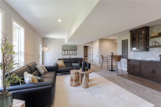 12850 N Arbor Way, Platte City, MO 64079 - living room with light colored carpet, wet bar, and recessed lighting
