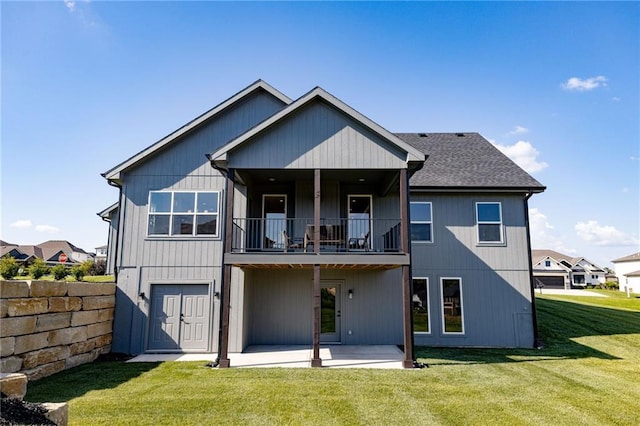 12850 N Arbor Way, Platte City, MO 64079 - rear view of property featuring a balcony, a patio, and a yard