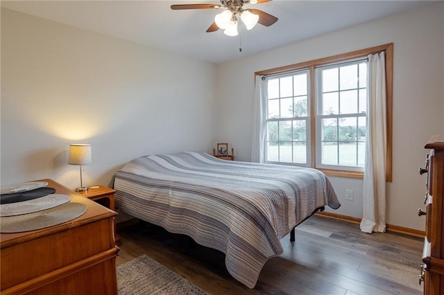 bedroom featuring dark hardwood / wood-style flooring and ceiling fan