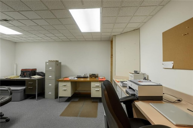 office space featuring dark carpet and a drop ceiling