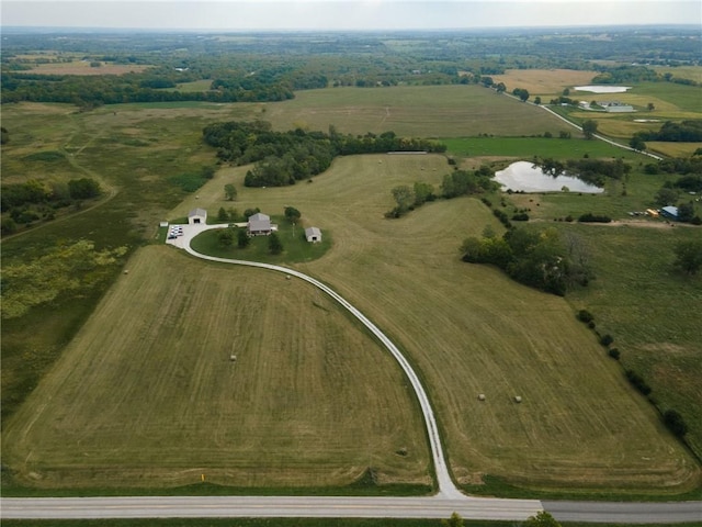 aerial view featuring a water view and a rural view