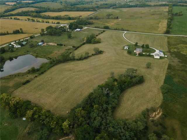 drone / aerial view with a water view and a rural view