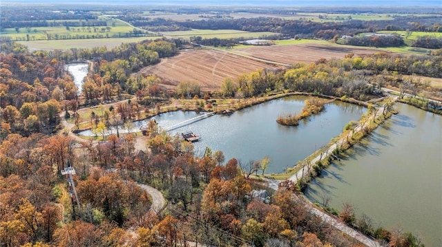 birds eye view of property with a rural view and a water view