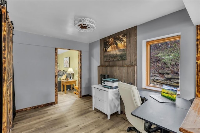 office featuring light wood-style flooring and baseboards