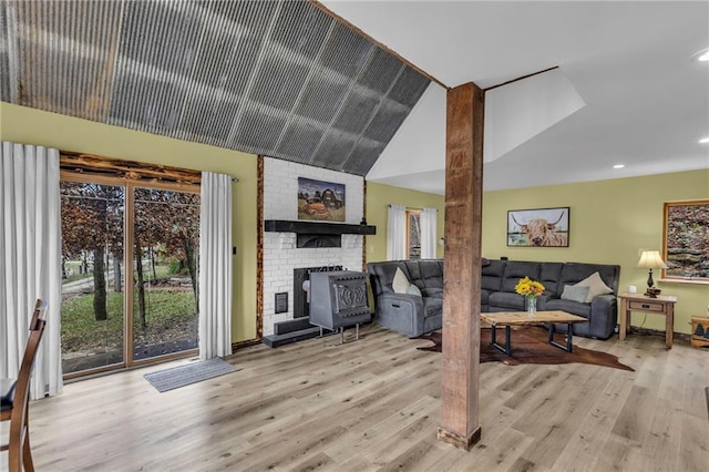 living room featuring lofted ceiling, recessed lighting, and wood finished floors