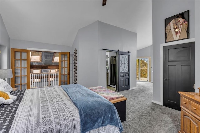 carpeted bedroom with high vaulted ceiling, a barn door, and baseboards