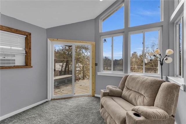 sunroom / solarium featuring cooling unit and vaulted ceiling