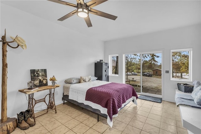 bedroom with access to exterior, light tile patterned flooring, and ceiling fan