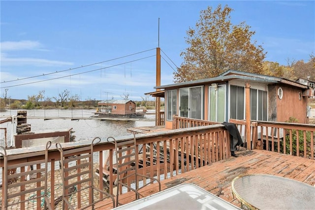 wooden deck with a sunroom