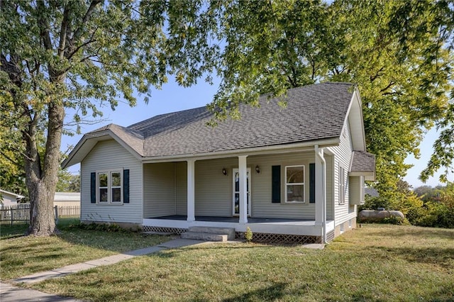 view of front of home featuring a porch and a front lawn